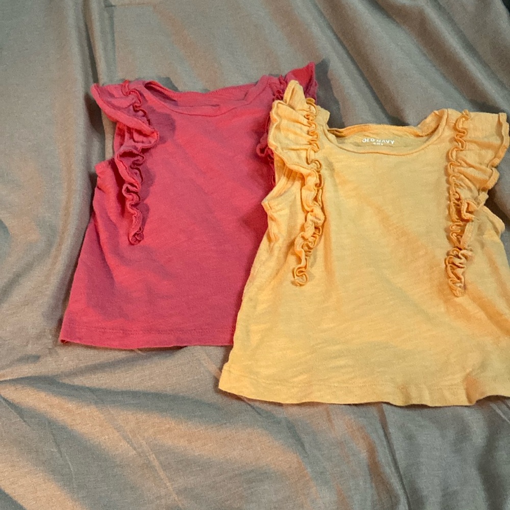 2 sleeveless shirts